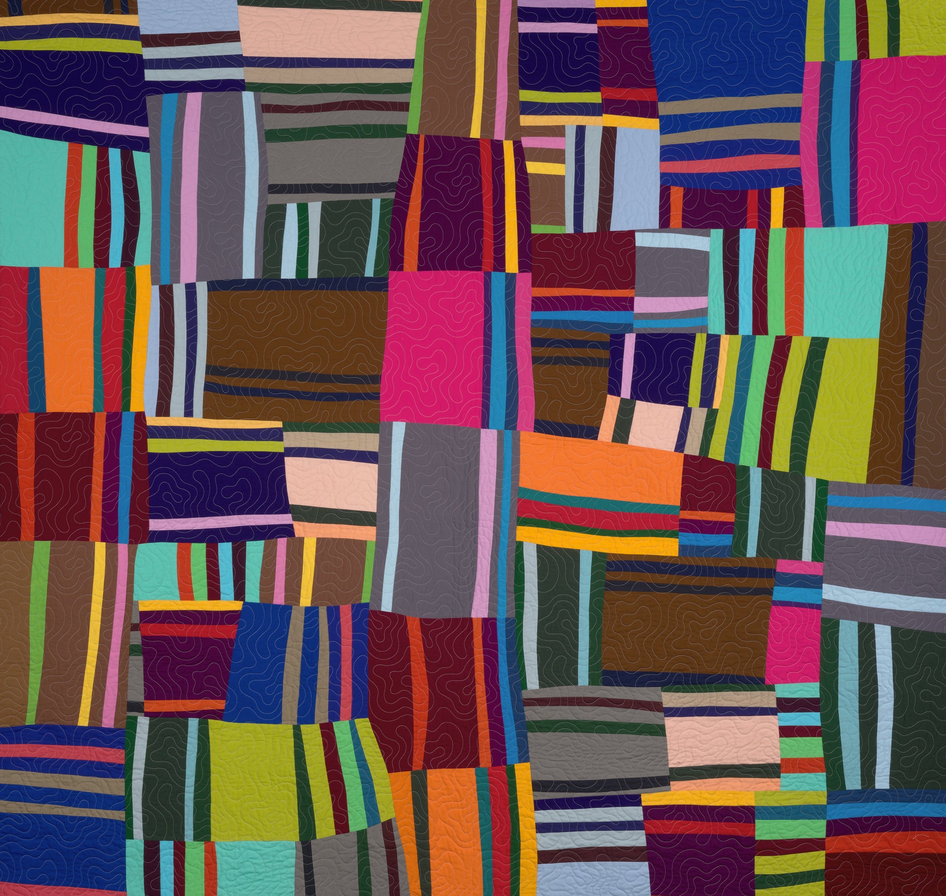 Multicolored patchwork quilt with various geometric patterns