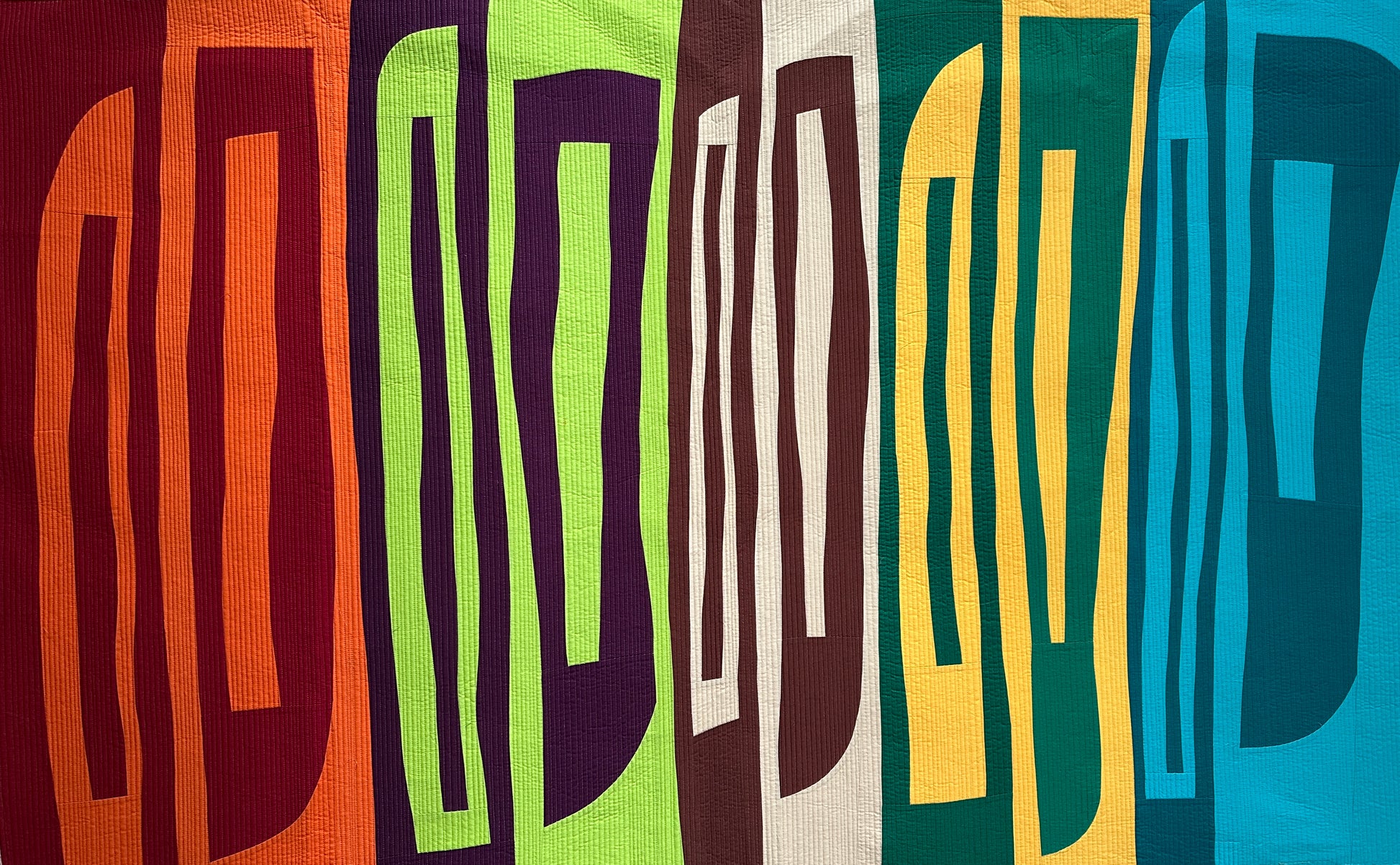 Colorful pattern with abstract shapes in an abstract art quilt